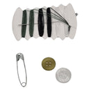 Spool of thread, needle, safety pin, and buttons on a white background