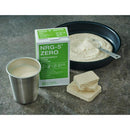 NRG-5 Zero emergency vegan survival food pack with powdered ration, prepared meal, and metal cup on gray surface