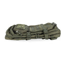 Folded olive green MIL-TEC US Assault 36L combat backpack with MOLLE straps and multiple compartments visible
