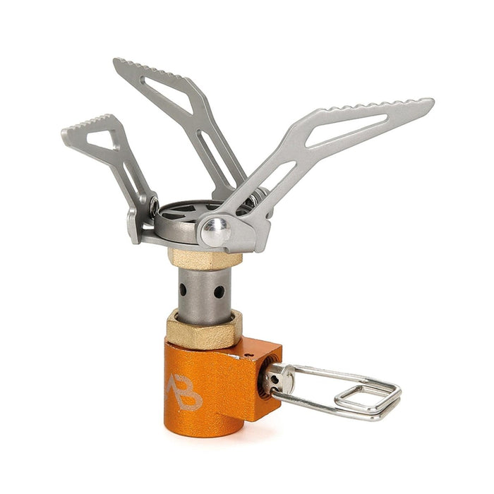 Compact lightweight titanium foldable camping stove burner with orange base for hiking and outdoor use