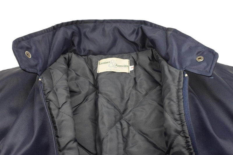 Close-up of the inside quilted liner and collar of a blue Lambert French Air Forces bomber jacket.