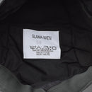 Close-up of the label inside a genuine Austrian military gray GoreTex army cap showing material and care instructions.
