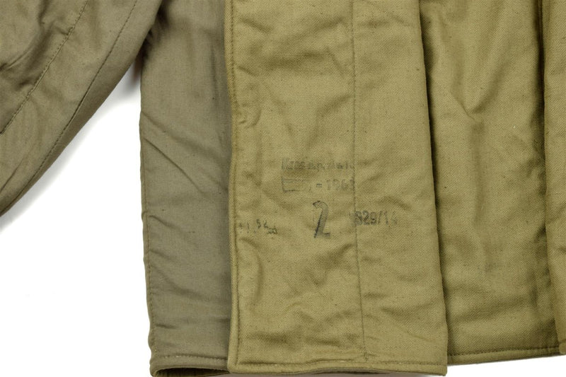 Close-up of genuine Czech army M60 quilted liner jacket interior showing quilted cotton fabric and stamped markings