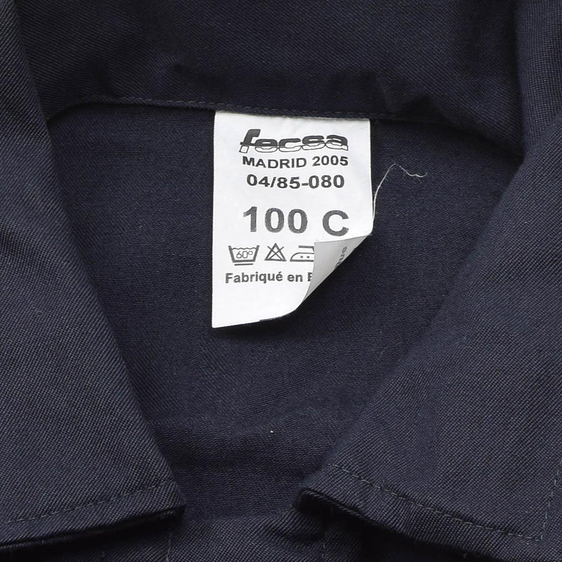Close-up of a genuine French navy thermostable marine jumpsuit label showing size 100C and care instructions