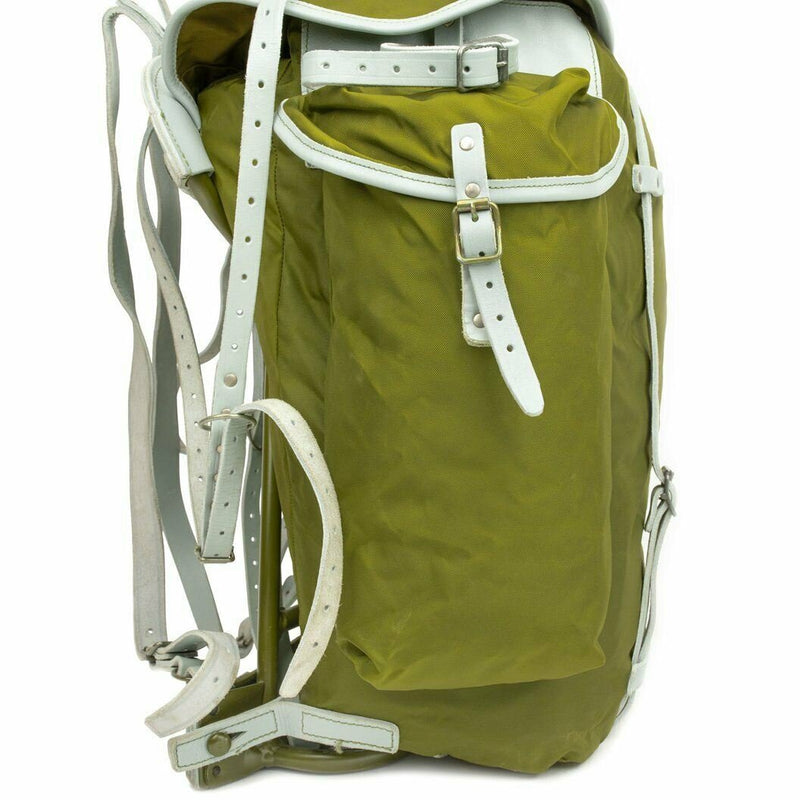 Vintage Norwegian military backpack with metal frame, olive canvas, and white leather straps for rugged outdoor use.