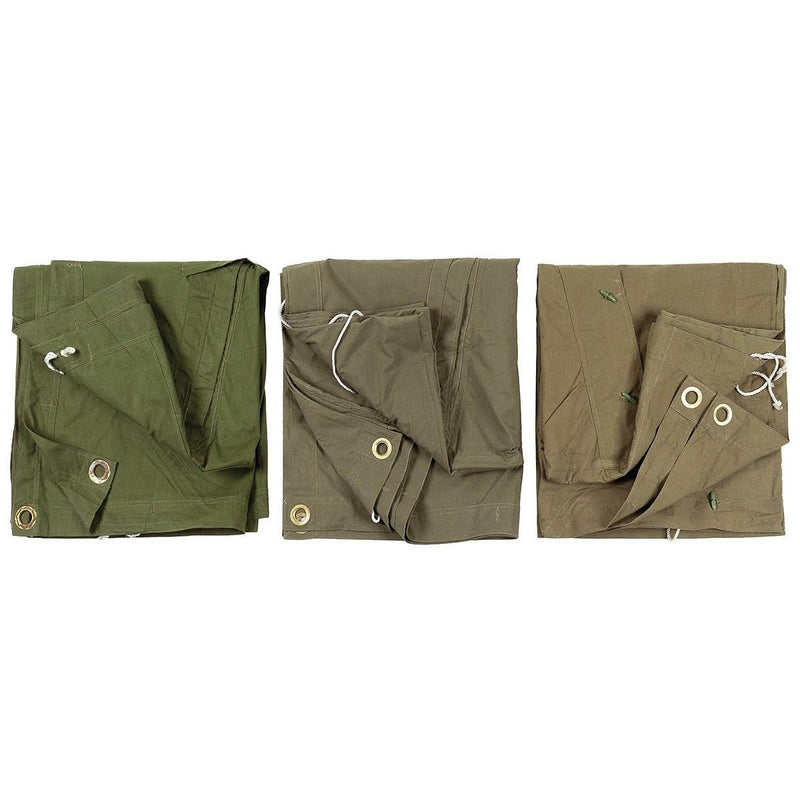 Three folded genuine Romanian Army waterproof tarpaulin tents in olive and brown shades with grommets and button details