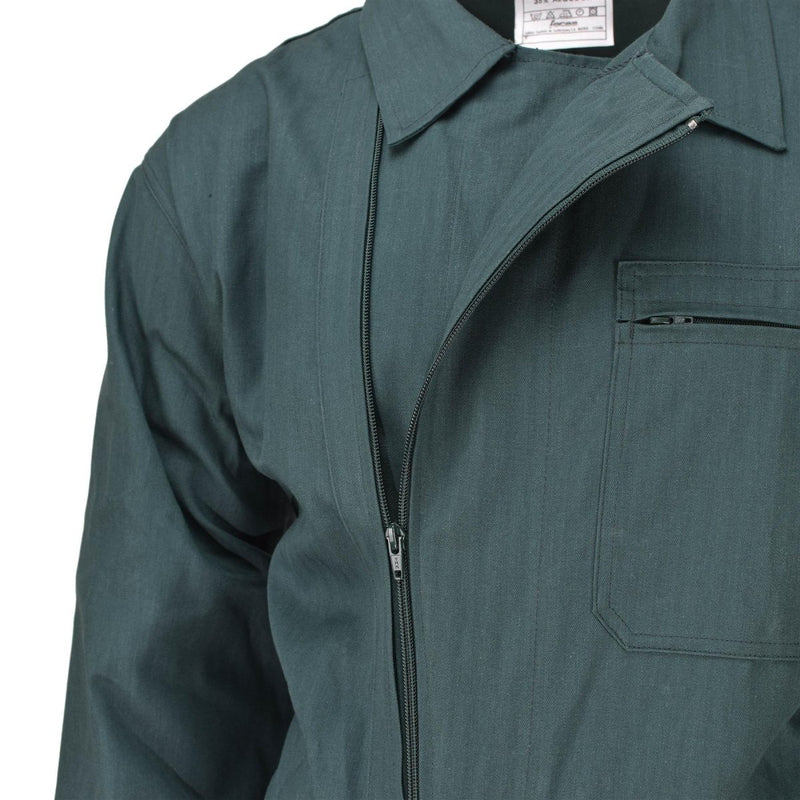 Close-up of green Spanish military workwear coverall with zipper and zippered chest pocket detail