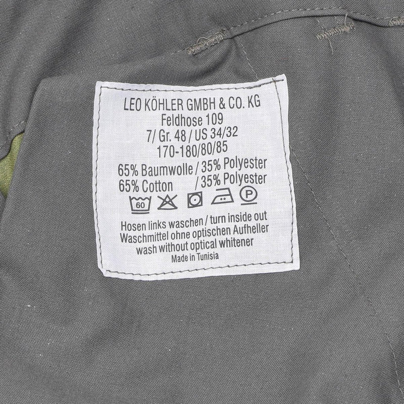 Leo Köhler activewear pants label showing size, fabric composition 65% cotton 35% polyester, and care instructions.