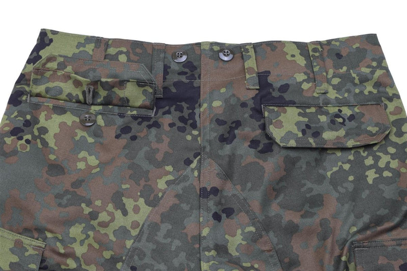 Close-up of Leo Köhler BDU pants with Bundeswehr Flecktarn camo, cargo pockets, and reinforced seat and knees.