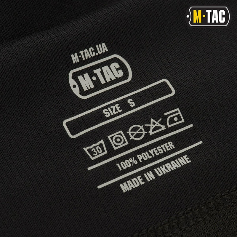 Close-up of M-TAC black balaclava label showing size small, fabric care symbols, 100% polyester, made in Ukraine.