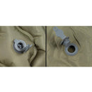 Close-up of gray inflation valve on olive green MFH inflatable sleeping pad with headrest roll-up mat.