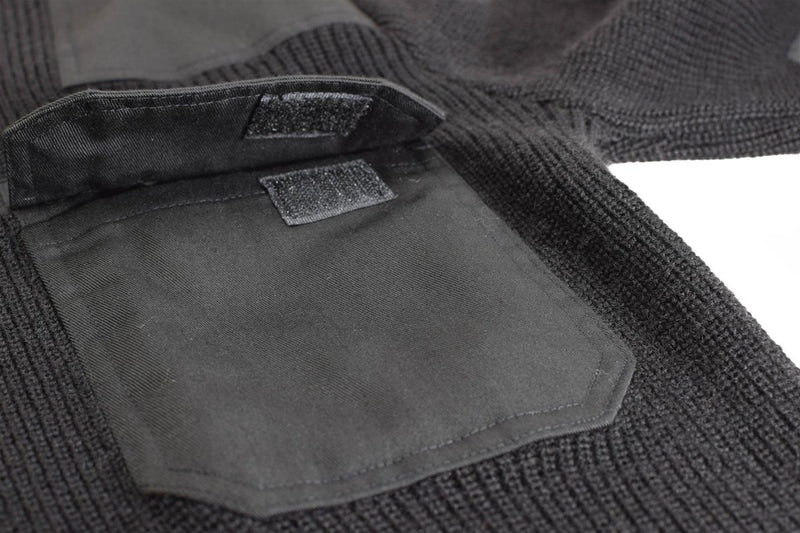 Close-up of black Mil-Tec German Bundeswehr sweater showing reinforced elbow pad and shoulder epaulet details