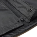Close-up of black Mil-Tec waterproof men's rain jacket showing zipper and button details on durable fabric.