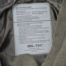 Close-up of Mil-Tec German army parka label showing fabric details and care instructions inside fleece liner