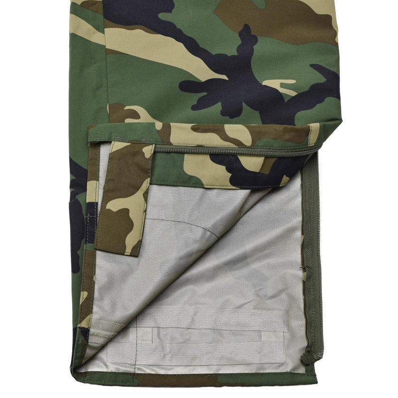 Detail of MIL-TEC military style waterproof windproof pants with camouflage pattern and inner lining visible