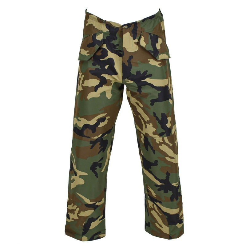 MIL-TEC military-style camouflage cold weather pants with waterproof, windproof fabric and multiple pockets.
