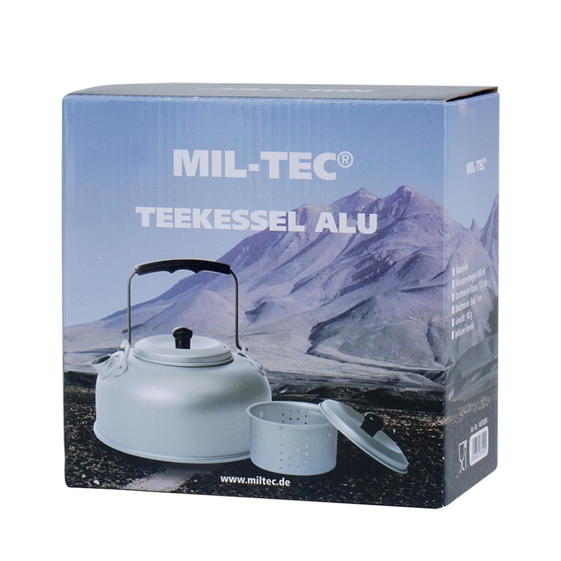 MIL-TEC lightweight aluminum teakettle 800ml with tea strainer for camping and outdoor use in rugged mountain setting packaging