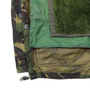 Close-up of original Dutch army M65 waterproof military parka lining showing camouflage outer shell and green thermal inner fleece layer