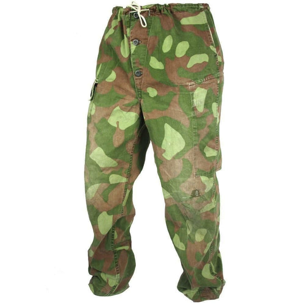 Original Finnish M62 reversible army camo pants in green and brown camouflage with durable material and multiple pockets.