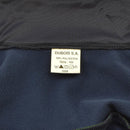 Close-up of Original French army tracksuit jacket label showing 100% polyester fabric and care instructions.