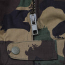 Close-up of zipper and button detail on a four-color woodland camouflage Hungarian military field jacket M1990.