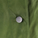 Close-up of green Swedish army M59 jacket fabric with metal button featuring three crowns emblem