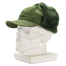 Original Swedish military green M59 winter cap with earflaps and faux fur lining displayed on mannequin head