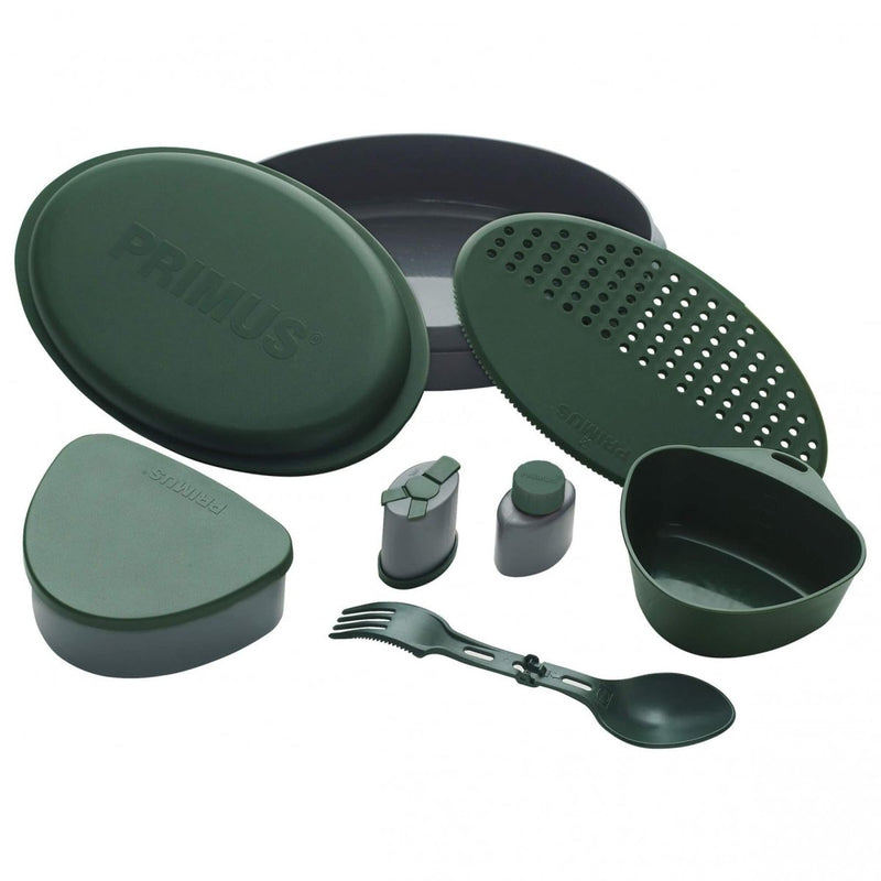 Green Primus Frigg W Piezo camping mess kit with plates, strainer, containers, and spork for outdoor meals