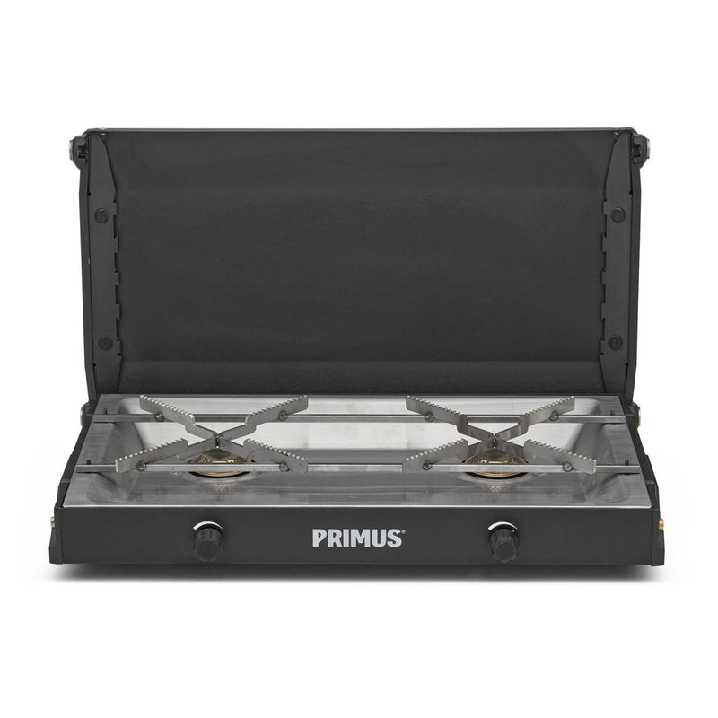 Primus Kinjia dual burner portable camping stove with black exterior and stainless steel pot supports