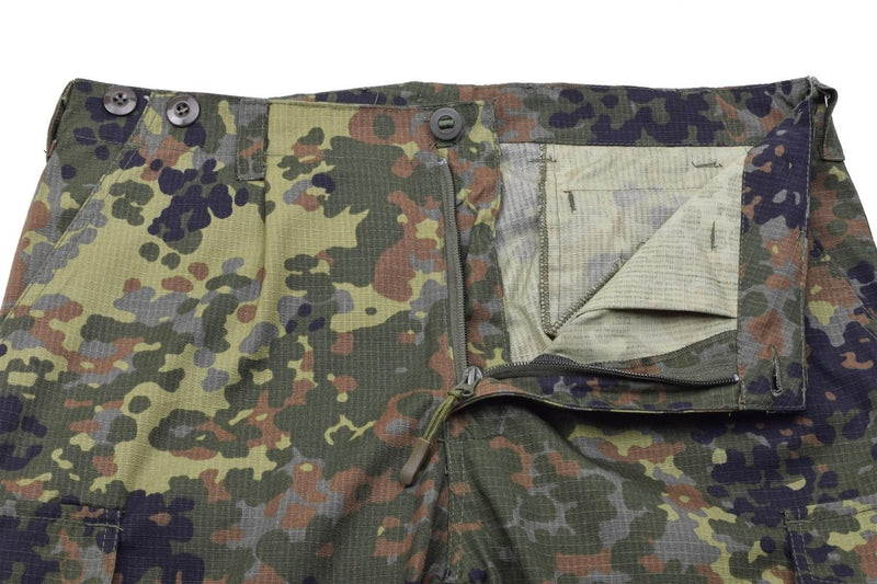 Close-up of TACGEAR German Army style flecktarn camo cargo pants with zipper and button fly in ripstop fabric.