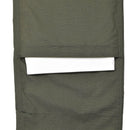 Close-up of olive ripstop fabric cargo pocket on TACGEAR military reinforced tactical pants with white item inside pocket