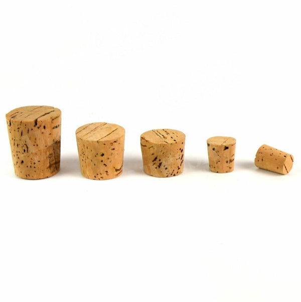 Set of five vintage tapered natural cork plugs for sealing bottles, jars, and containers in various sizes.