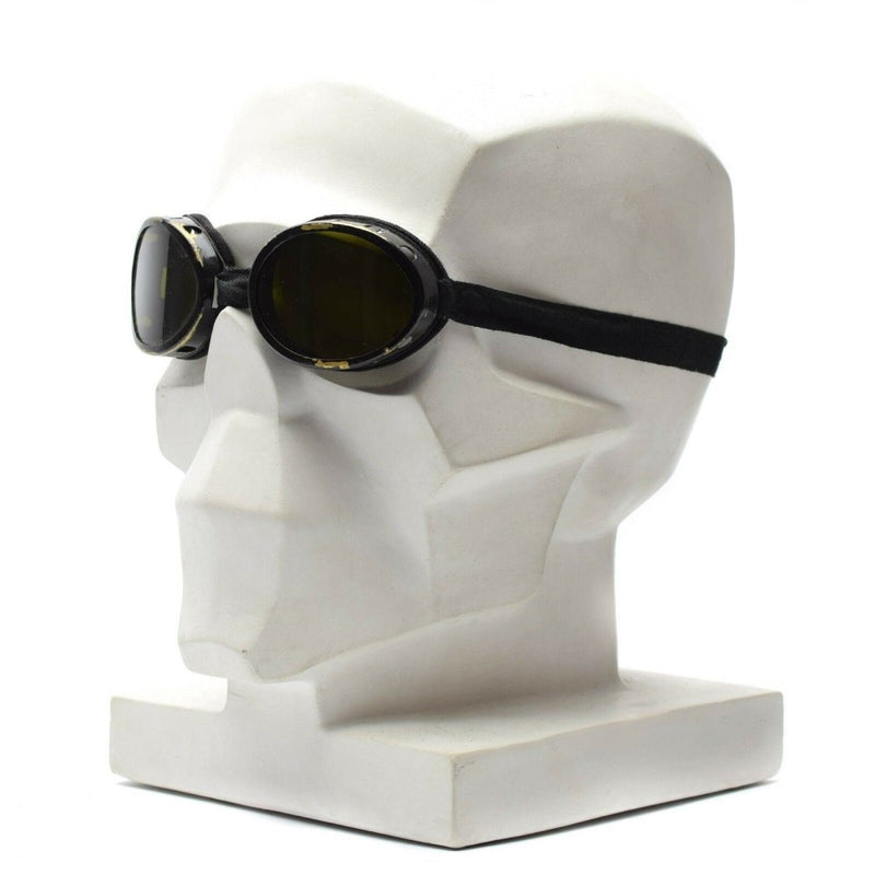 WWII genuine Swiss army round helmet goggles with dark lenses and black strap displayed on mannequin head